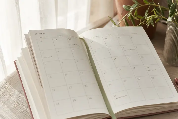 Open planner pages in soft daylight